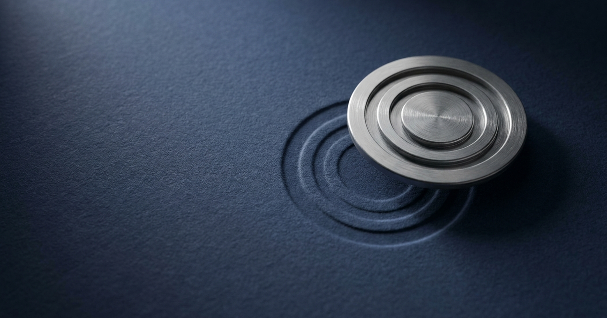 A brushed-steel approval seal raised on deep-navy paper, offset from the faint ghost of its own earlier impression — a metaphor for an AI system that has drifted from what was approved.
