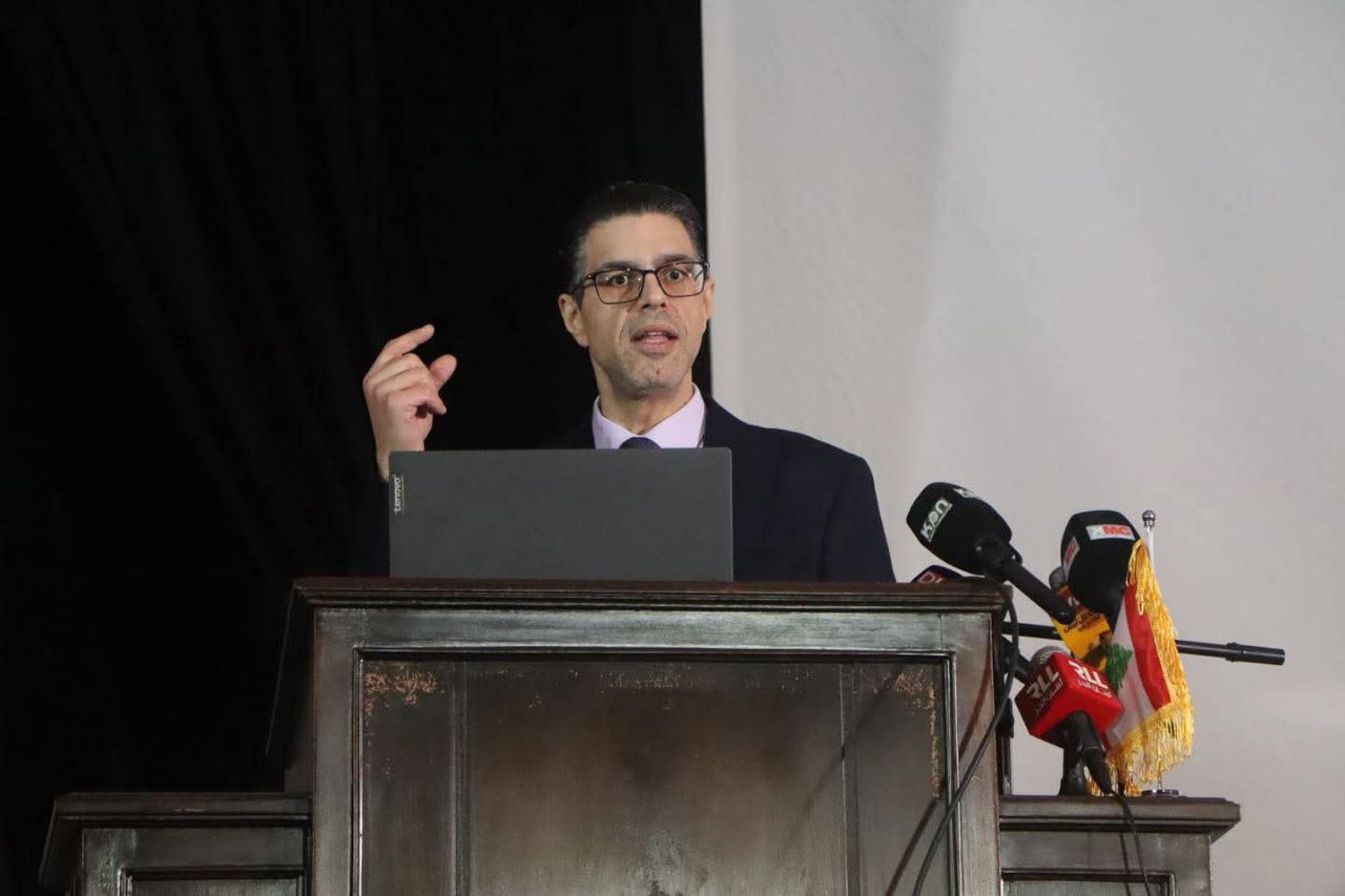 Dr. Jonah Tebaa speaking at a conference